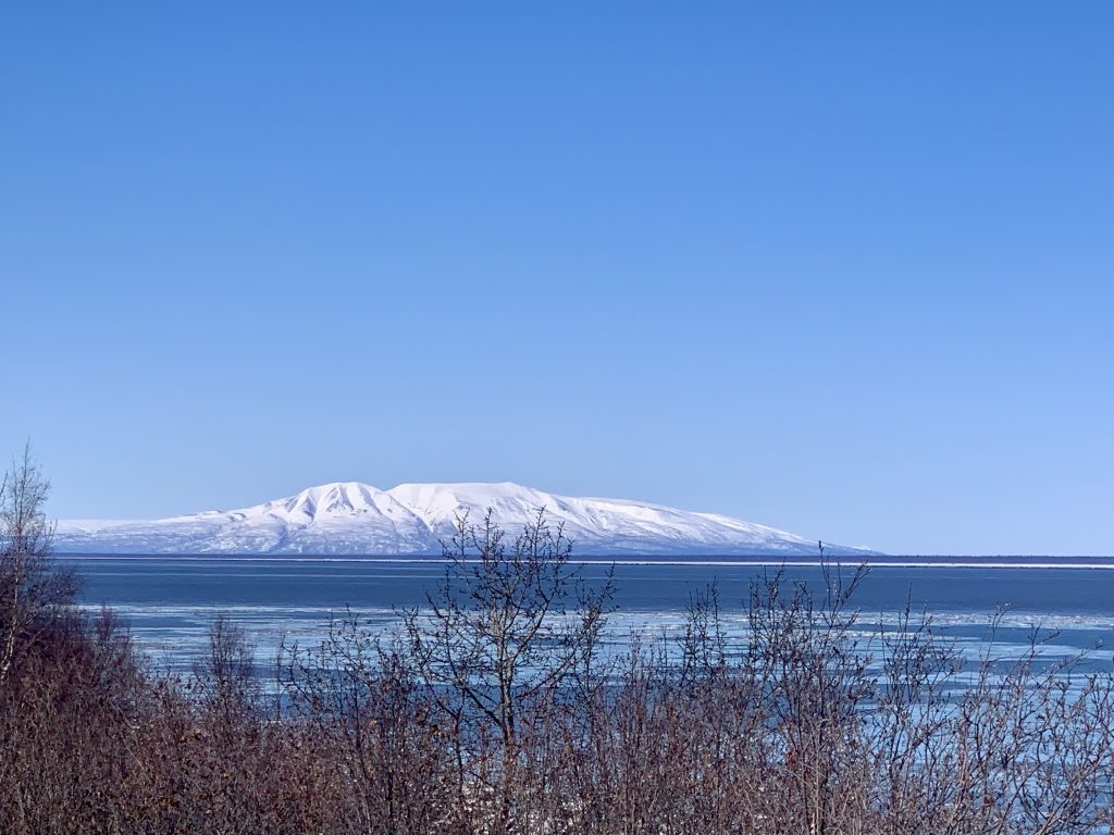 Snow-covered Sleeping Lady Mountain (Mount Susitna) with the Cook Inlet in the foreground near Anchorage