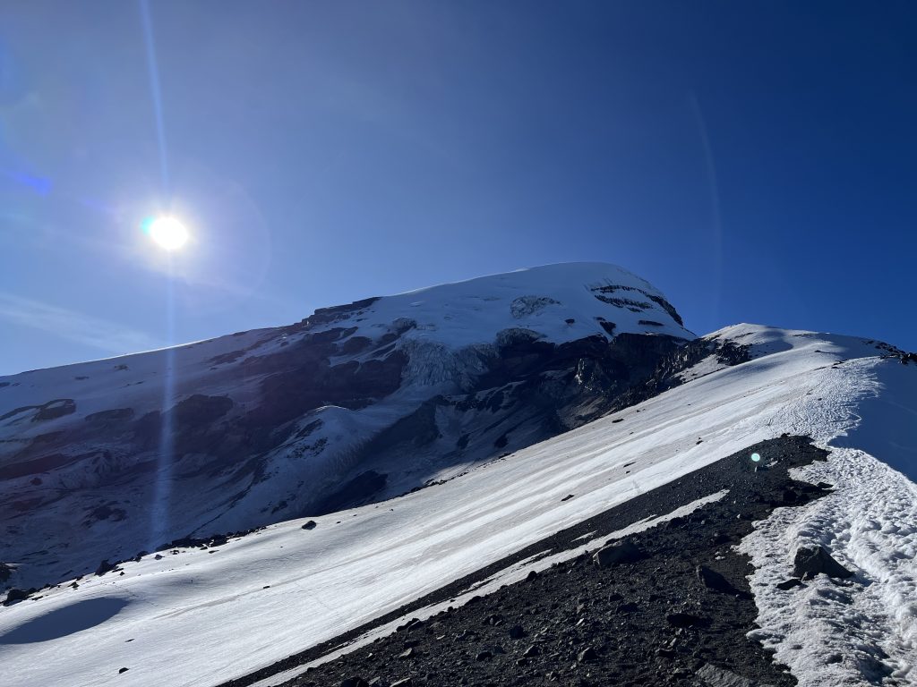 View of Chimborazo's snow-covered peak under a clear blue sky