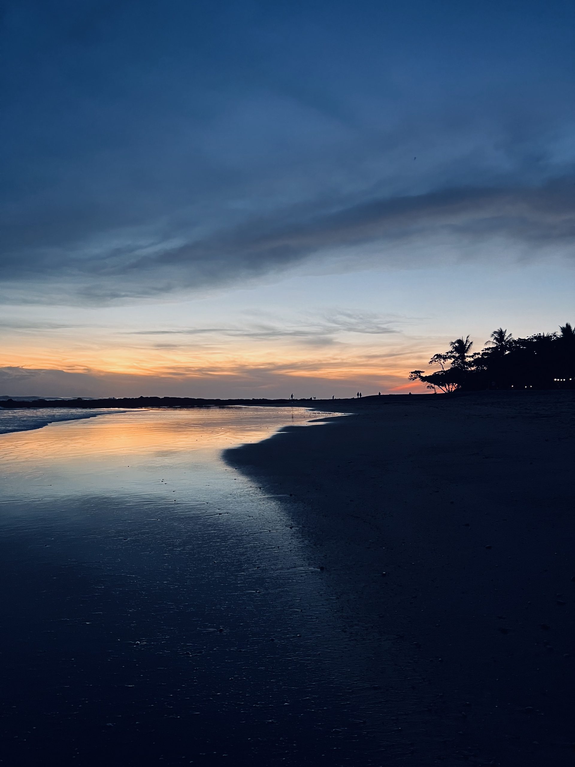 Sunset reflecting on the shoreline at a beach in Guanacaste, Costa Rica